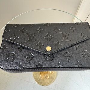 Louis Vuitton Black Embossed Leather Clutch